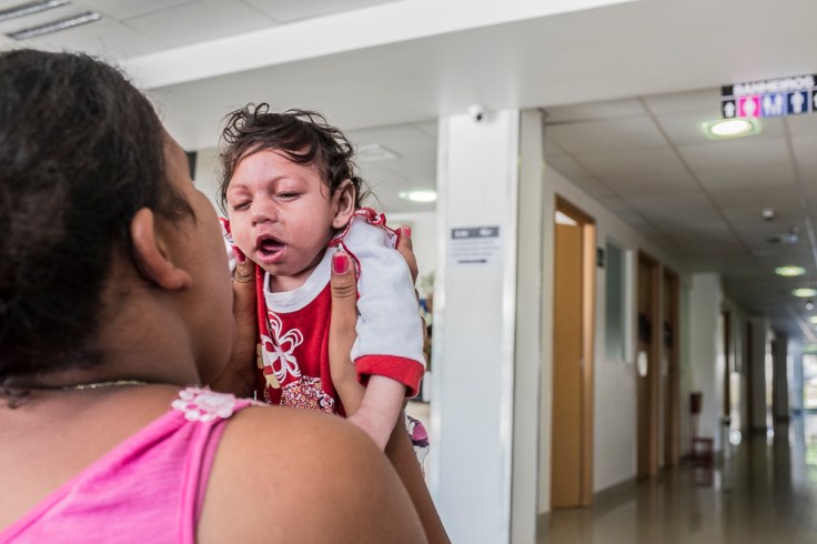 Jayane (17), her daughter Nathally (6 months) and her husband Daniel (20) waiting for their turn at the rehabilitation center FAV (Fundação Atilio Valente) in Recife, Pernambuco. Jayane and her husband Daniel are indigenous people of the tribe Xukuru d