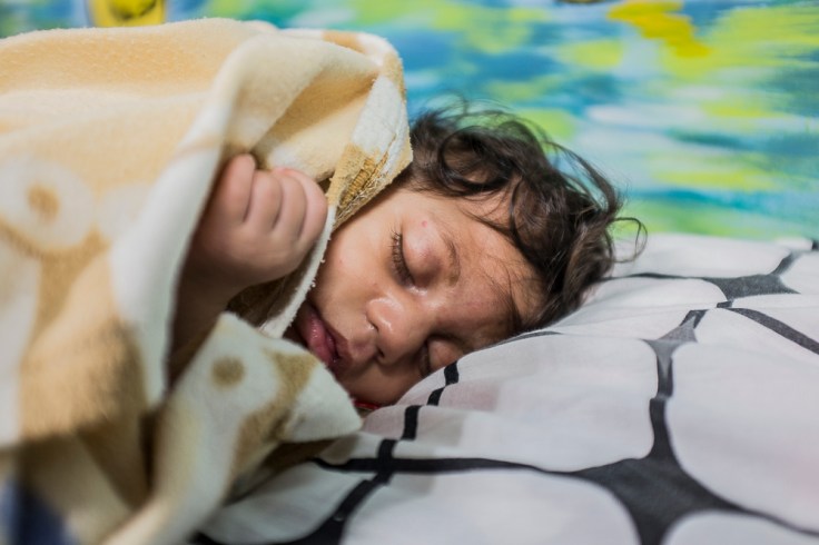 Jayane (17) and her daughter with severe microcephaly Nathally (